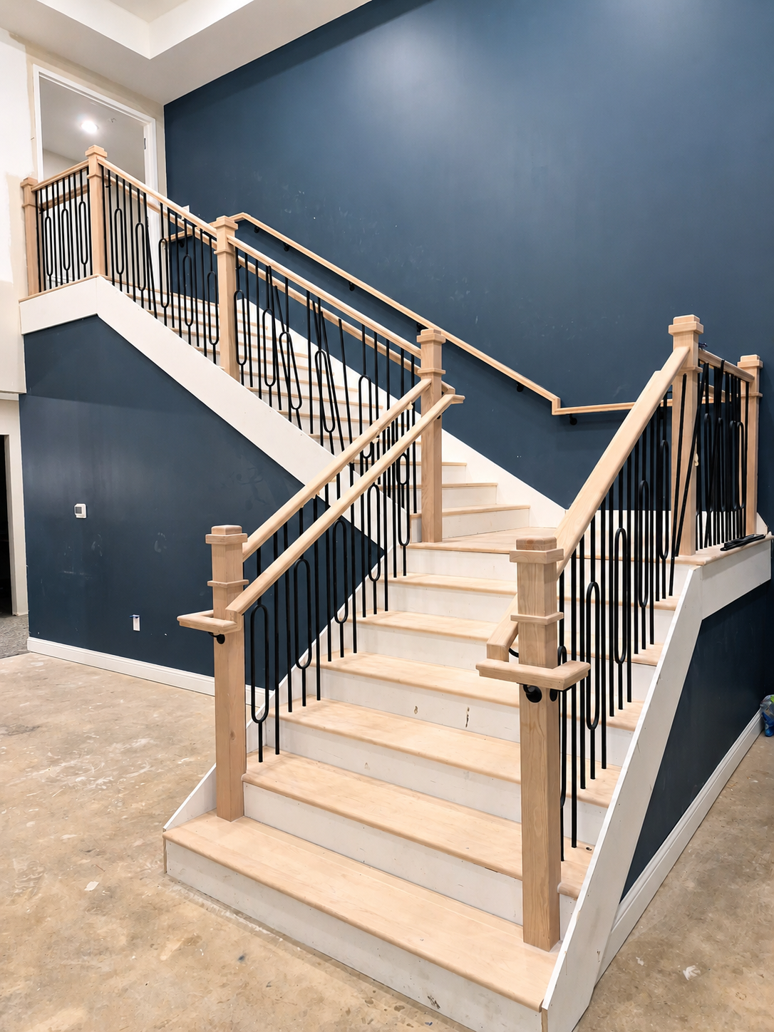 Custom commercial staircase railing and baluster installation by Industrious Duo